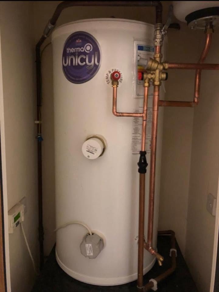 Completed unvented hot water cylinder installation with new controls