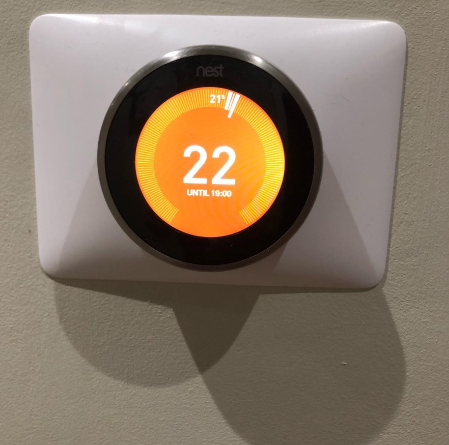Smart heating thermostat set to 22 degrees after a heating control upgrade